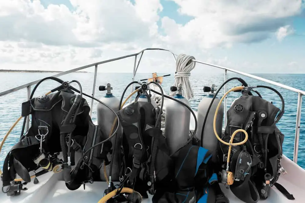 diving equipment piled up on a boat