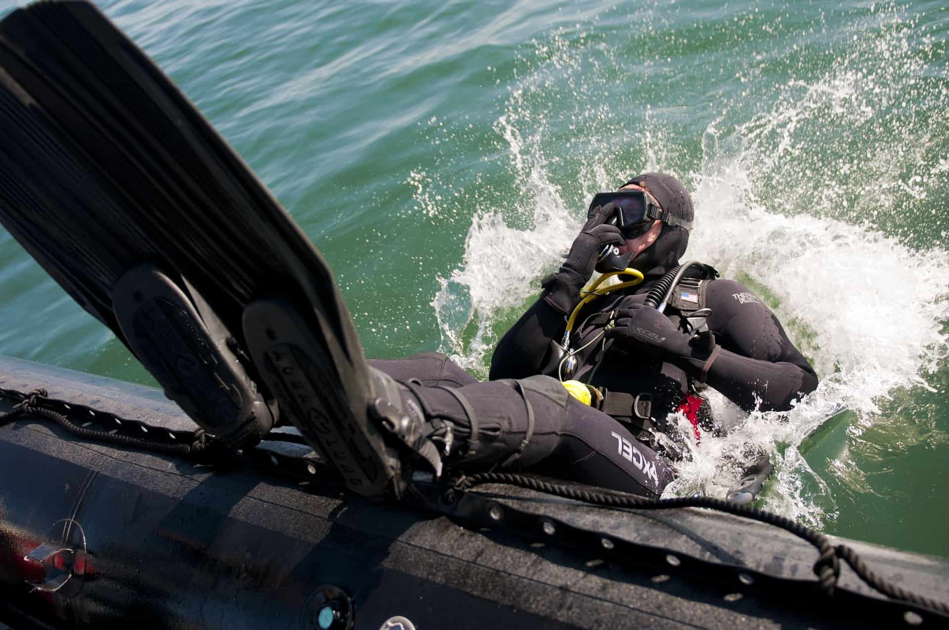 Diver entering the water through a backward role