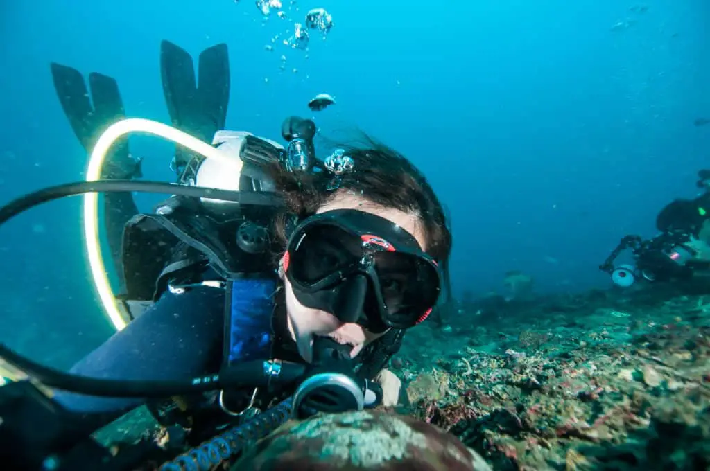 Diver underwater with Console-mounted dive computer