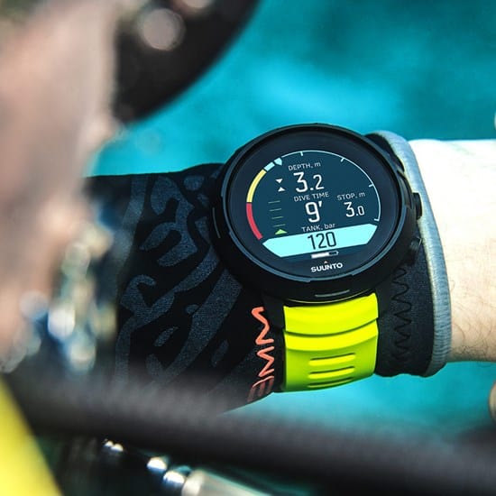 Suunto D5 yellow on wrist - monitoring all essential dive parameters including Air Nitrox on an easy to read display and alerts to warn about safety stop violations, etc.