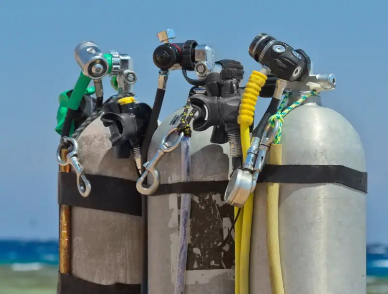 Tanks filled and ready for diving ready to connect to an air integrated dive computer
